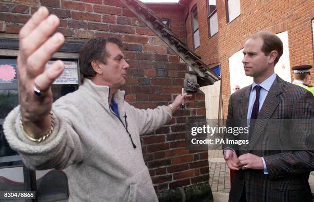 Prince Edward speaks with Vernon Jay a local Jeweller. Mr. Jay was washed away and rescued by the Southern Coastguard during recent floods in...