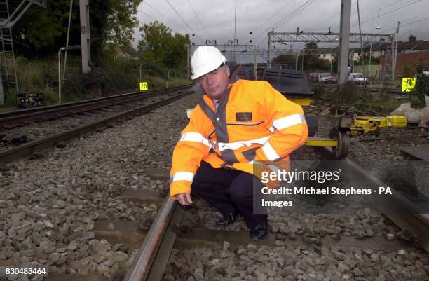Railtrack chief execuitve Gerald Corbett inspects a section of track that has been rerailed at Leighton Buzzard, Bedfordshire. Mr Corbett was called...