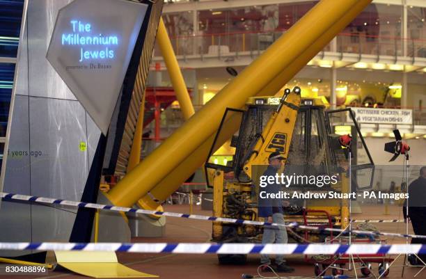 An excavator at the scene after a raid on 350 million of diamonds on show at the Millennium Dome in SE London. Six people were arrested, including...