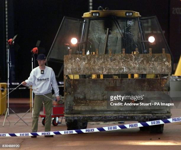 An excavator at the scene after a raid on 350 million of diamonds on show at the Millennium Dome in SE London. Six people were arrested, including...
