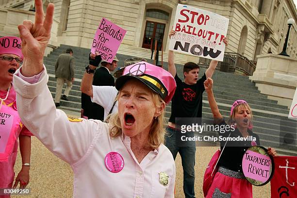 Demonstrators from the group Code Pink protest in front of the Cannon House Office Building on Capitol Hill September 29, 2008 in Washington, DC. The...