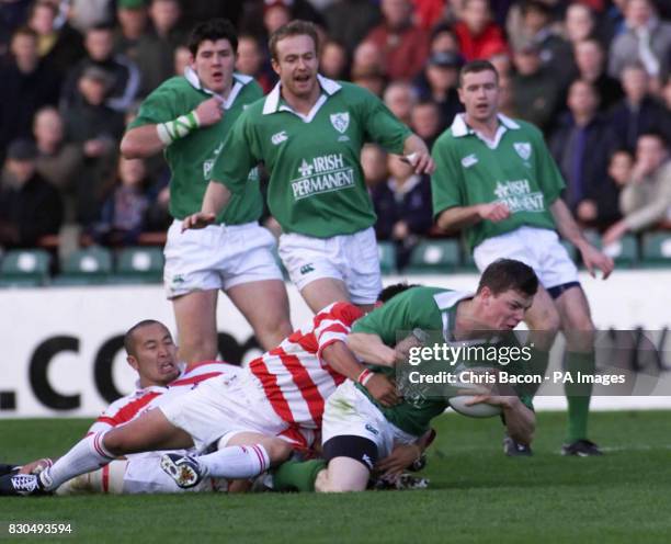 Ireland's centre Brian O'Driscoll brought down by Hiroyuki Tanuma of Japan during the International friendly at Lansdowne Road, Dublin