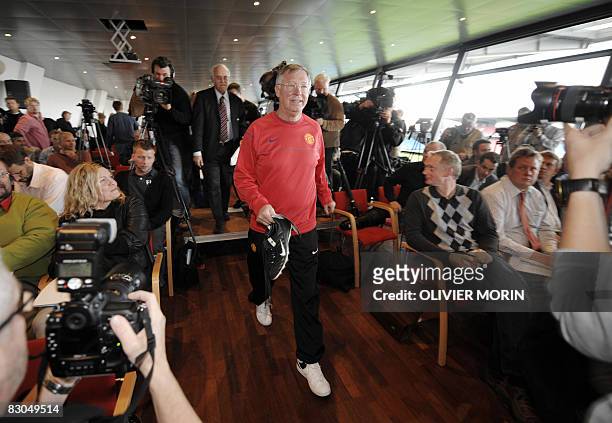 Manchester United Manager Sir Alex Ferguson arrives for a press conference at the stadium in Aalborg, in northern Denmark, on September 29 the day...