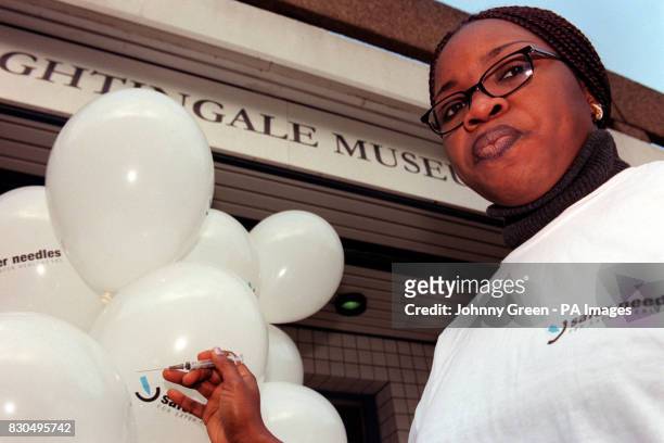 Moriam Olayiwola, a second year student nurse at Kings Florence Nightingale School of Nursing in London, displays a needle at the Florence...