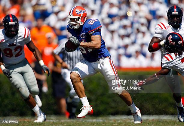 Tight end Aaron Hernandez of the Florida Gators runs for some yards after a catch against the Mississippi Rebels during the game on September 27,...