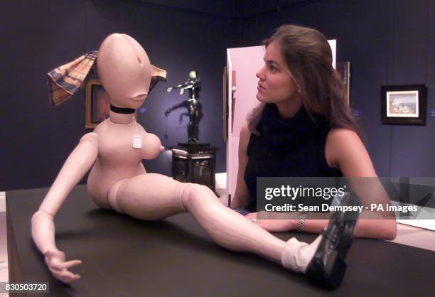 Sotheby's employee Kristin Gelder with La Demie Poupee executed in 1971 by Hans Bellmer, at Sotheby's in London. The piece is expected to fetch...