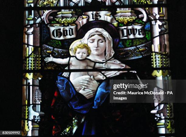 Stained glass window of Madonna and child inside Dornoch Cathedral in the Highlands of Scotland, which is tipped to be the location used for...