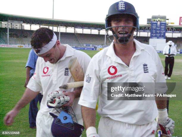 England skipper Nasser Hussain and team mate Graham Thorpe leave the field after England won their current test match series against Pakistan, at the...