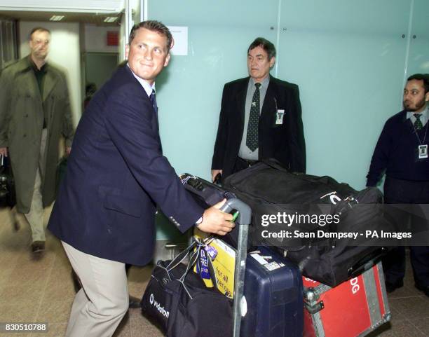 England cricket player Darren Gough arrives back at Heathrow airport from Pakistan after England beat Pakistan in the test series in Karachi. Victory...