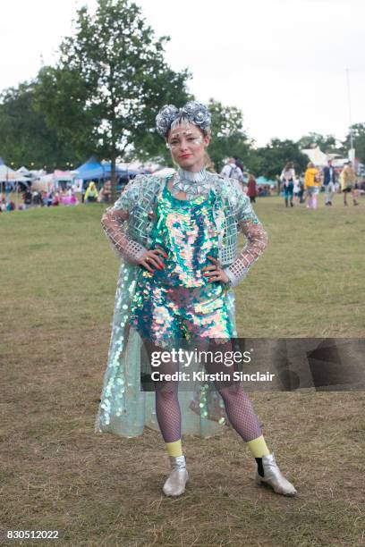 Fashion Designer Twinks Burnett wears a Twinks Burnett head piece, Wolf and Moon earrings, Jane Bowler necklace and jacket, Rosa Bloom top and...