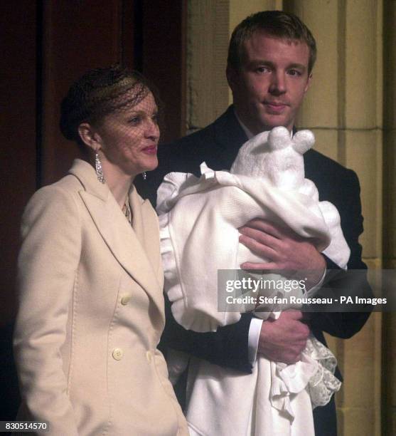 Pop star Madonna and partner Guy Ritchie leave Dornoch Cathedral after having their baby Rocco Christened. She was wearing a cream full length coat...