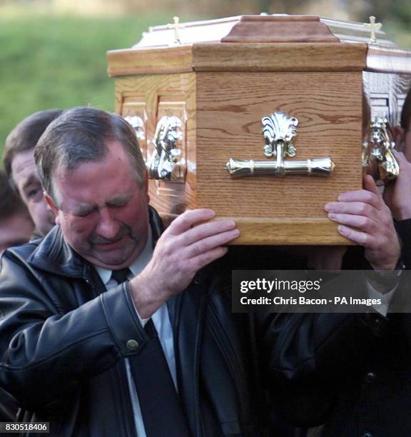 Owen McAloon carries the coffin of his daughter Louise at the parish church in Scotstown. Louise and her cousin Veronica died when they fell through...