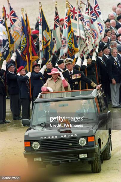 The Queen and the Duke of Edinburgh arrive by Range Rover on the beach at Arromanches, Normandy, for the 50th anniversary memorial service of the...