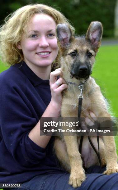 Kennel assistant Alison Walsh with Rian, a 13 week old German shepherd/Briard-cross at the RSPCA Millbrook Animal Centre at Chobham. Rian is another...