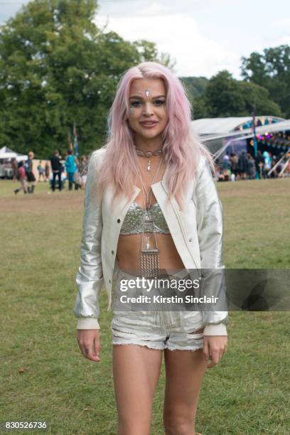 Student Eva Gregertsen wears an Ann Summers Bra top, Miss Guided shorts, vintage jacket and a River Island bag on day 3 of Wilderness Festival on...
