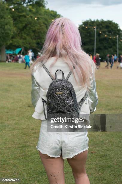 Student Eva Gregertsen wears Miss Guided shorts, vintage jacket and a River Island bag on day 3 of Wilderness Festival on August 5, 2017 in Cornbury...