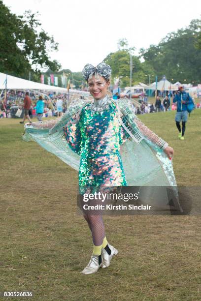 Fashion Designer Twinks Burnett wears a Twinks Burnett head piece, Wolf and Moon earrings, Jane Bowler necklace and jacket, Rosa Bloom top and...