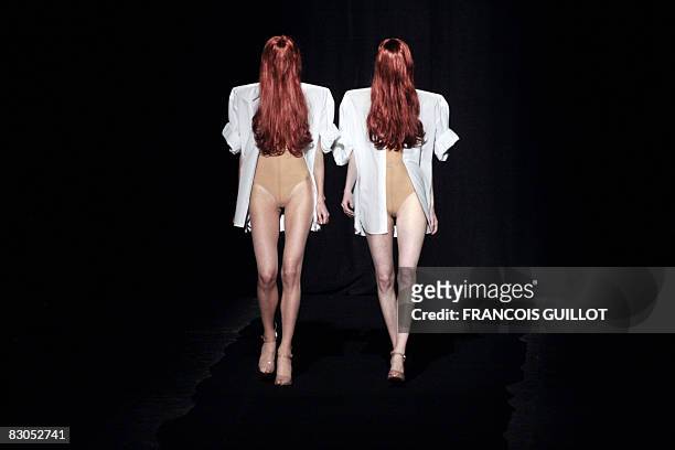 Models present creations by Belgian designer Martin Margiela during the spring/summer 2009 ready-to-wear collection show in Paris, on September 29,...