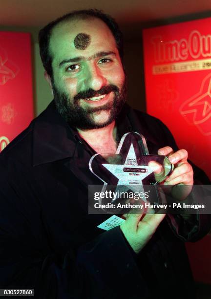 British-based Iranian Omid Djalili - who has shaved a hole in his beard and stuck it to his forehead - was named best stand-up comic at the Time Out...