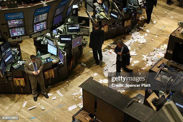 Traders work on the floor of the New York Stock Exchange after the closing bell September 29, 2008 in New York City. U.S. Stocks took a nosedive in...