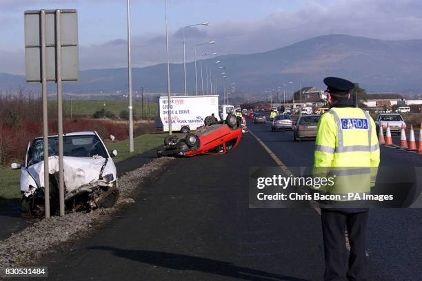 Irish Police display a number of crashed cars along the main Dublin to Belfast road at Dundalk. All the vehicles have been involved in serious...