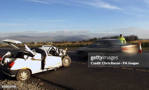 Irish Police display a number of crashed cars along the main Dublin to Belfast road at Dundalk. All the vehicles have been involved in serious...