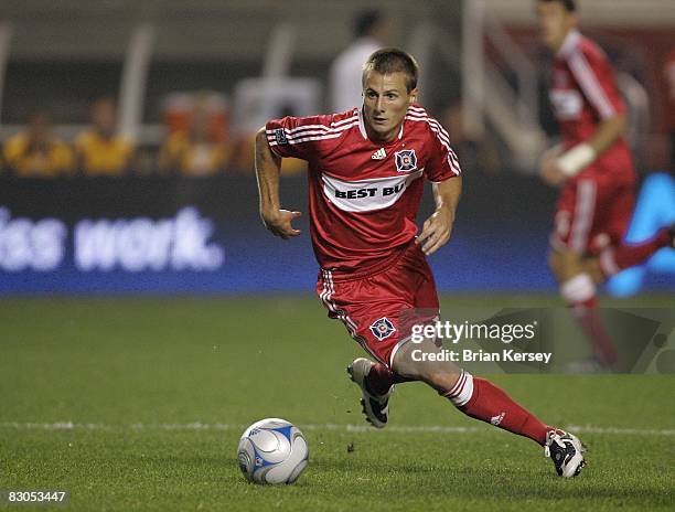 Chris Rolfe of the Chicago Fire moves the ball against the Los Angeles Galaxy during the second half at Toyota Park on September 25, 2008 in...