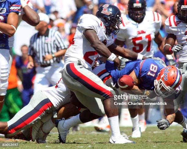 Wide receiver Aaron Hernandez of the Florida Gators catches a pass for a large gain before being stripped by cornerback Cassius Vaughn of the...