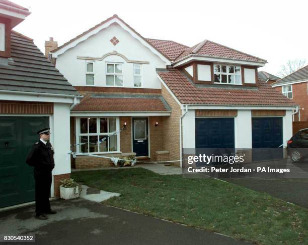 Police officer outside the house Camberley in Surrey, where the bodies Anthony Smith a former sergeant in the British Army, his wife Kay and their...