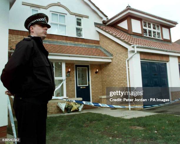 Police officer outside the house Camberley in Surrey, where the bodies Anthony Smith a former sergeant in the British Army, his wife Kay and their...