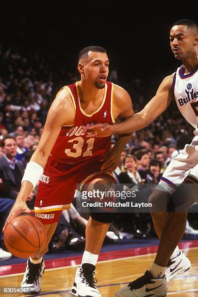Tracy Murray of the Houston Rockets dribbles to the basket during a NBA basketball game against the Washington Bullets at USAir Arena on February 17,...