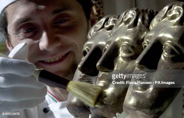Le Meridien Grosvenor House Executive Chef Fabrizio Cadei puts the finishing touches to the first of 180 BAFTA chocolate masks, commissioned by the...