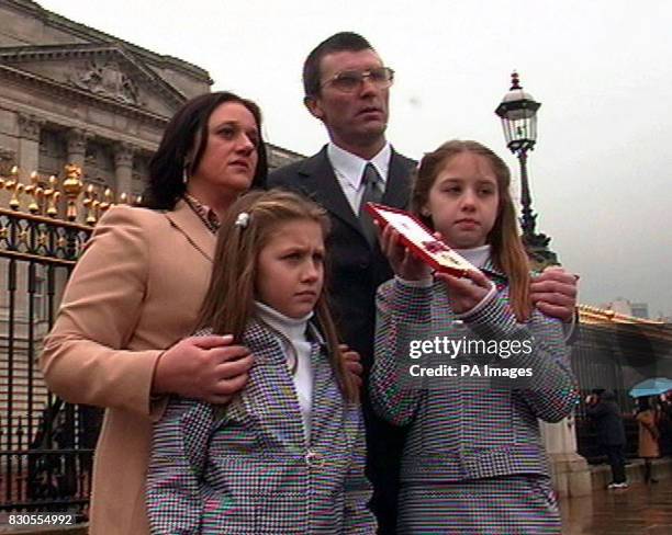 Videograbbed image of the parents, John and Alana, and sisters, Alana, eight and Emma, ten - the family of heroine Eliza Ward outside Buckingham...