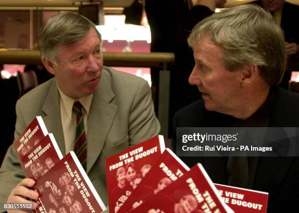 Eric Harrison with Manchester United manager Sir Alex Ferguson during his book launch, at Old Trafford, Manchester. Mr Harrison has written the book,...