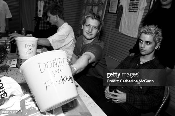 Green Day solicit donations for HIV/AIDS organization LIFEbeat at a record store appearance in 1994 in New York City, New York.