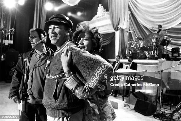 April 1993: Aretha Franklin hugs Smokey Robinson at a rehearsal for the "Aretha Franklin: Duets" concert to benefit the Gay Men's Health Crisis at...