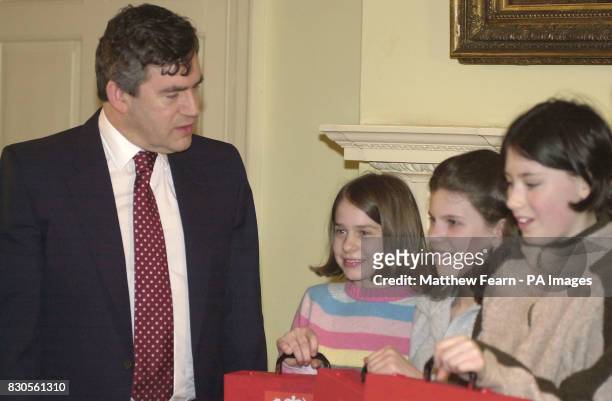 Chancellor of the Exchequer Gordon Brown with 11-year-old Esme Anderson from Greenwich, 11-year-old Kate Harshall from Chatham 12-year-old Lilly...