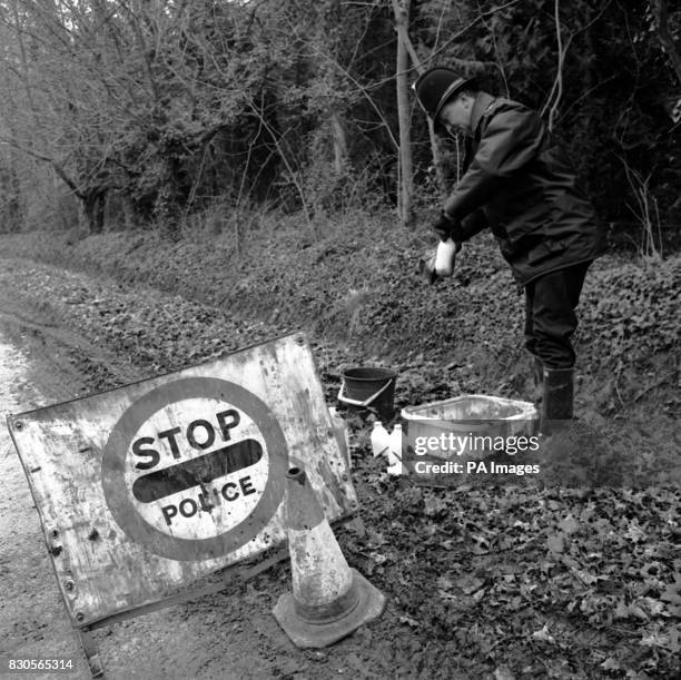 An outbreak of Foot-and-Mouth disease was confirmed at a farm near Yarmouth, Isle of Wight. A policeman, guarding the area, disinfects the daily...