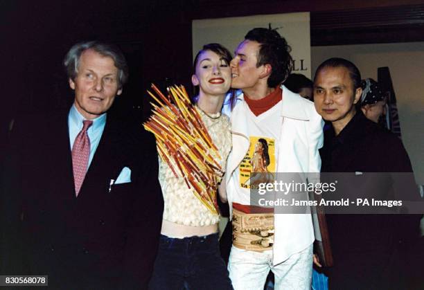 Count Anton Wolfgang von Faber-Castell, Polish fashion designer Arkadius, kissing one of his models, and shoe designer Jimmy Choo at the 240th...