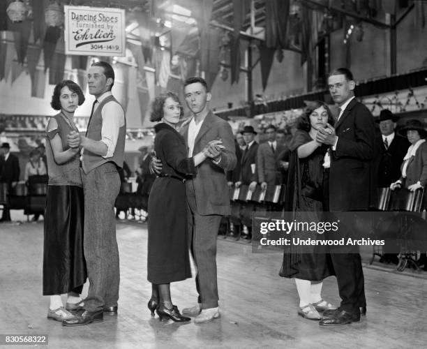 Three marathon dancers pose at the start of the dancing, Washington DC, April 20, 1923.