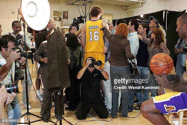 Pau Gasol of the Los Angeles Lakers speaks with the media while Kobe Bryant of the Los Angeles Lakers poses for a portrait during NBA Media Day on...