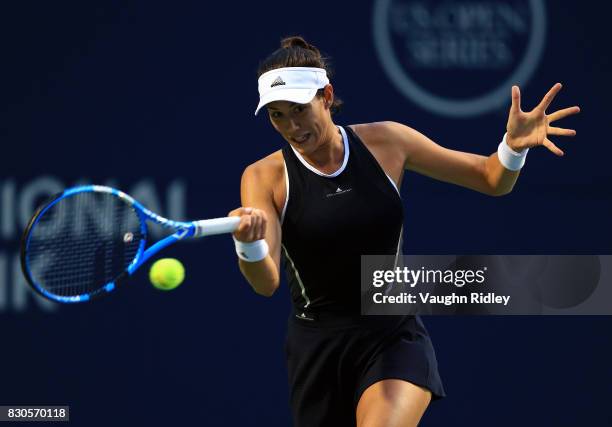 Garbine Muguruza of Spain plays a shot against Elina Svitolina of Ukraine during Day 7 of the Rogers Cup at Aviva Centre on August 11, 2017 in...