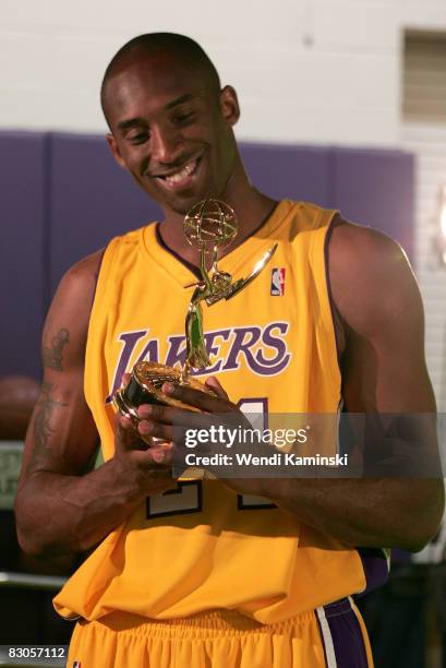 Kobe Bryant of the Los Angeles Lakers looks at a miniature Emmy Award statue during NBA Media Day on September 29, 2008 at the Toyota Sports Center...