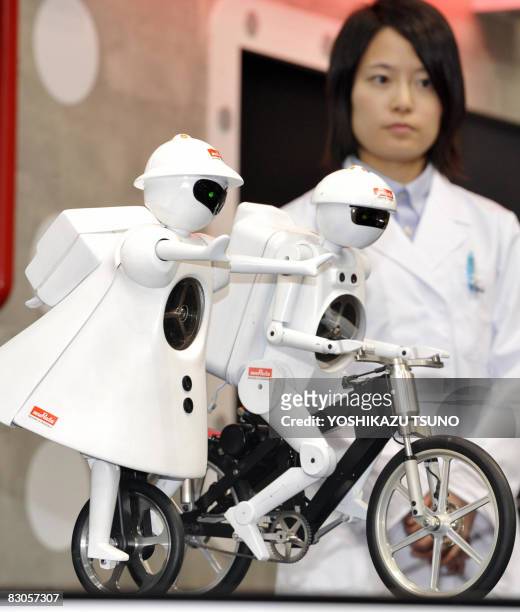 Japanese electronics parts maker Murata Electronics unveils a unicycle robot called the "Murata-seiko-chan" , which has various sensors to keep its...