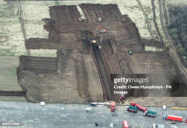 The dumping of sheep and cattle begins at a huge burial site at a disused airfield at Great Orton in Cumbria where a trench has been dug to dispose...