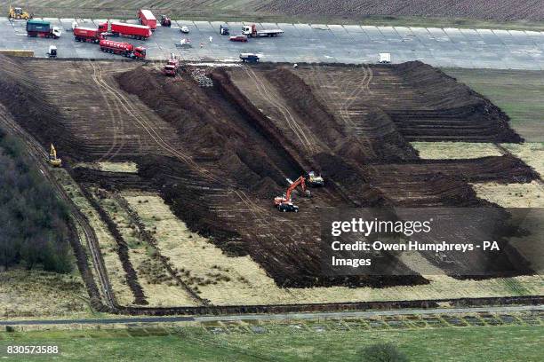 Dead animals lie slaughtered in a trench near an old airfield near Longtown in Cumbria as the foot-and-mouth crisis continues.