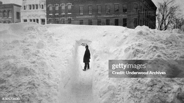 Tunnel cut through the snow drifts on Main Street after a blizzard, Northampton, Massachusetts, March 14, 1888.