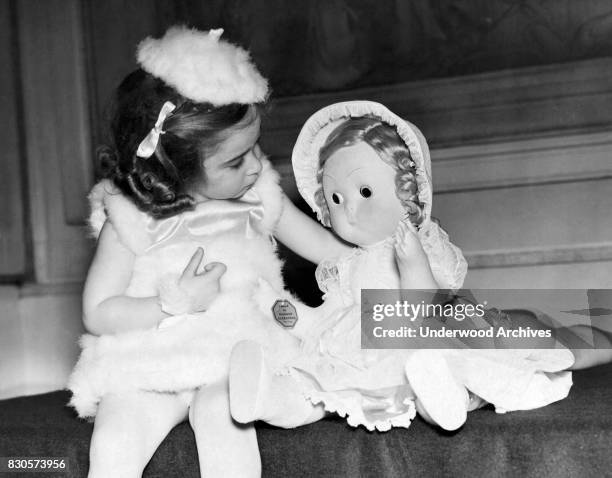 Little Simone Myers with her doll which was the 'Queen Mary's Prize' at the Peter Pan Party at the Claridge's Hotel today, London, England, May 1,...
