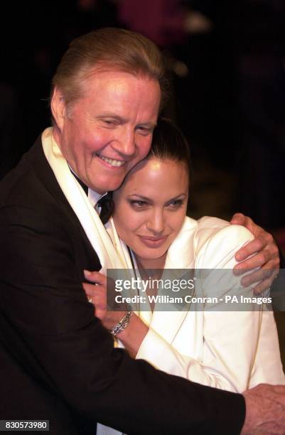Actor Jon Voight and daughter actress Angelina Jolie at the Vanity Fair Post Oscars Party, held at Morton's in Los Angeles, USA. Angelina is wearing...