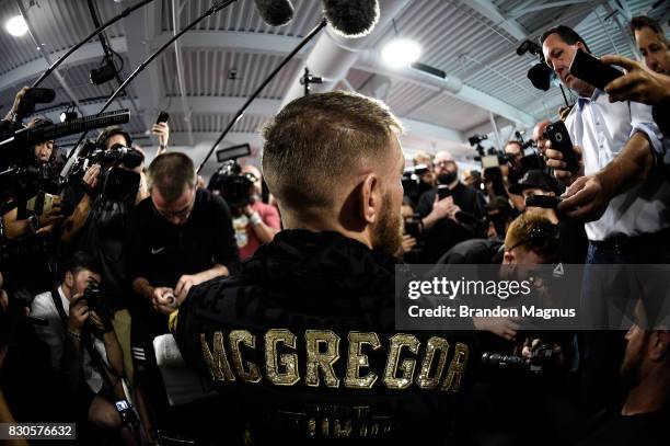 Lightweight champion Conor McGregor gets his hands wrapped during a media workout at the UFC Performance Institute on August 11, 2017 in Las Vegas,...